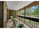 Relaxing balcony with seating and views of a lush, green landscape and open recreational space at 214 Caryl Way, Oldsmar, FL 34677