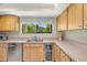 Functional kitchen with stainless appliances, cabinets, and view of outdoors at 214 Caryl Way, Oldsmar, FL 34677