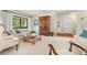 Large living room with neutral carpet, plenty of light, and stylish accents at 214 Caryl Way, Oldsmar, FL 34677