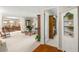 Spacious living room with neutral carpet, open floor plan, and easy access to other living areas at 214 Caryl Way, Oldsmar, FL 34677