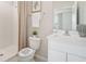 Bright bathroom with a walk-in shower, vanity, and neutral color palette at 2328 Stratten Dr, Zephyrhills, FL 33541
