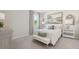 Inviting bedroom with soft bedding, large window, and stylish decor at 2328 Stratten Dr, Zephyrhills, FL 33541