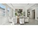 Elegant dining room with large windows and decorative floral displays at 2328 Stratten Dr, Zephyrhills, FL 33541