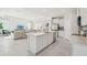 Contemporary kitchen open to the living area, featuring a large island at 2328 Stratten Dr, Zephyrhills, FL 33541