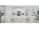 Bright kitchen featuring stainless steel appliances and an island with seating at 2328 Stratten Dr, Zephyrhills, FL 33541