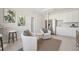 Cozy seating area with a bar, stainless steel appliances, and modern decor at 2328 Stratten Dr, Zephyrhills, FL 33541