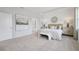 Spacious main bedroom with a seating area and ensuite bathroom at 2328 Stratten Dr, Zephyrhills, FL 33541