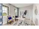 Bright home office with natural light, modern decor, and comfortable seating perfect for remote work at 2328 Stratten Dr, Zephyrhills, FL 33541