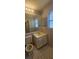 Bathroom with standard features, including a toilet, sink and vanity, and lighting at 2503 Elm St, Seffner, FL 33584