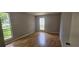Bright bedroom features wood-look floors and natural light from a large window at 2503 Elm St, Seffner, FL 33584