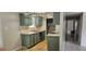 This kitchen features a sink, cabinets, and laminate flooring at 2503 Elm St, Seffner, FL 33584