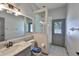 Bathroom with tiled floors, glass shower, and white marble sink at 3633 Springville Dr, Valrico, FL 33596