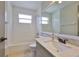 This full bathroom features a shower and tub combo, as well as a sink and vanity at 3633 Springville Dr, Valrico, FL 33596