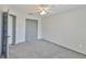 This cozy bedroom features plush carpeting, a closet, and adjacent bathroom access at 3633 Springville Dr, Valrico, FL 33596