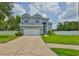 Charming two-story home with well-maintained lawn, mature landscaping, and inviting curb appeal at 3633 Springville Dr, Valrico, FL 33596