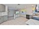 Bright kitchen featuring updated countertops, modern lighting, and a breakfast bar that opens to a living area at 3633 Springville Dr, Valrico, FL 33596
