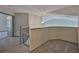 Landing with a grey carpet and trim, with access to two bedrooms at 3633 Springville Dr, Valrico, FL 33596