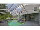 Screened-in pool area with a bar and a jacuzzi, perfect for relaxation and entertainment at 3633 Springville Dr, Valrico, FL 33596