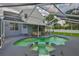 Beautiful backyard with in-ground pool, hot tub and covered patio, ideal for outdoor enjoyment at 3633 Springville Dr, Valrico, FL 33596