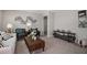 Inviting living room with stylish decor, comfortable seating, and a wooden coffee table on neutral carpet at 37106 Sagemoor Dr, Zephyrhills, FL 33541