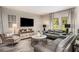 This living room features a flat screen TV, stylish furnishings, and a contemporary color palette at 37106 Sagemoor Dr, Zephyrhills, FL 33541
