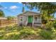 Charming exterior of a well-maintained home with a bright green front door and cozy porch at 3953 10Th S Ave, St Petersburg, FL 33711