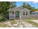 Charming single-story home with a green door and inviting front porch at 3953 10Th S Ave, St Petersburg, FL 33711