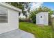 Backyard with storage shed and partial fence at 4318 Mesa Dr, New Port Richey, FL 34653