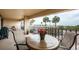 Relaxing balcony area with seating offering a scenic view of the pool and beach at 4450 Gulf Blvd # 110, St Pete Beach, FL 33706