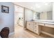 This bathroom is equipped with tile floors, generous cabinet space, and a long vanity at 4450 Gulf Blvd # 110, St Pete Beach, FL 33706