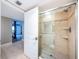 This bathroom features a glass shower enclosure and leads to the main bedroom at 4450 Gulf Blvd # 110, St Pete Beach, FL 33706