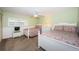 This bedroom has two twin beds, shuttered windows, and a ceiling fan at 4450 Gulf Blvd # 110, St Pete Beach, FL 33706