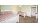 This bedroom has two beds, a ceiling fan, and access to a closet at 4450 Gulf Blvd # 110, St Pete Beach, FL 33706