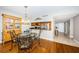 Charming dining room area adjacent to the kitchen and living room with hardwood floors at 4450 Gulf Blvd # 110, St Pete Beach, FL 33706