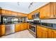 Well-equipped kitchen with stainless steel appliances, granite counters and wood cabinetry at 4450 Gulf Blvd # 110, St Pete Beach, FL 33706