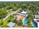 Stunning aerial view of a neighborhood with multiple swimming pools and lush green landscaping at 4522 S Hale Ave, Tampa, FL 33611