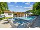 Stunning backyard with a pool, spa, and a covered patio, perfect for outdoor relaxation and entertainment at 4522 S Hale Ave, Tampa, FL 33611