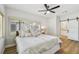 Neutral bedroom showcases wood floors and a sliding door to the bathroom at 4522 S Hale Ave, Tampa, FL 33611