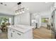 Kitchen with a center island with seating, open to the dining area and with stainless steel appliances at 4522 S Hale Ave, Tampa, FL 33611