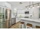 Renovated kitchen with stainless steel appliances, white cabinets, and subway tile backsplash at 4522 S Hale Ave, Tampa, FL 33611