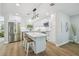 Gourmet kitchen features stainless steel appliances, white cabinets and a large marble island at 4522 S Hale Ave, Tampa, FL 33611
