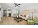 Comfortable living area with hardwood floors, sofa, arm chairs and a beverage center at 4522 S Hale Ave, Tampa, FL 33611