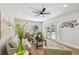 Cozy living room features hardwood floors, comfortable seating and access to outdoor pool at 4522 S Hale Ave, Tampa, FL 33611
