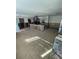 Large kitchen area featuring tiled flooring and an island, presenting a blank canvas for a dream culinary space at 6000 Denver Ne St, St Petersburg, FL 33703