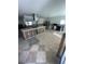 Spacious kitchen featuring tile flooring, with exposed studs for personalized renovation at 6000 Denver Ne St, St Petersburg, FL 33703