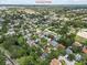 Aerial view of the home with a pool and neighborhood near Downtown St Pete at 6051 65Th N Ave, Pinellas Park, FL 33781