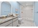 Updated bathroom showcasing a granite countertop and walk-in shower with glass door at 6051 65Th N Ave, Pinellas Park, FL 33781