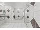 Bathroom showcasing a bathtub, shower, and decorative mosaic tile details at 6051 65Th N Ave, Pinellas Park, FL 33781