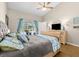 Bedroom featuring an upholstered headboard bed, blue accents, and a view of the pool at 6051 65Th N Ave, Pinellas Park, FL 33781