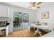 Cozy dining area with built in bench, backyard view and a sliding glass door for easy outdoor access at 6051 65Th N Ave, Pinellas Park, FL 33781